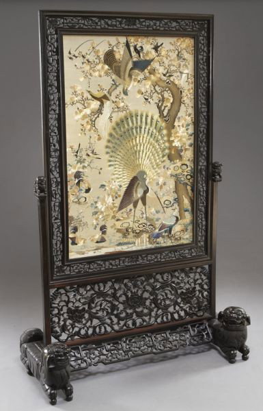 Chinese Canton School embroidery screen,: depicting birds and flowers, mounted in a finely carved rosewood stand, on foo lion feet. Panel: 43.5"H x 28.75"W; Overall: 73"H x 46"W, Circa - 18th - 19th C.