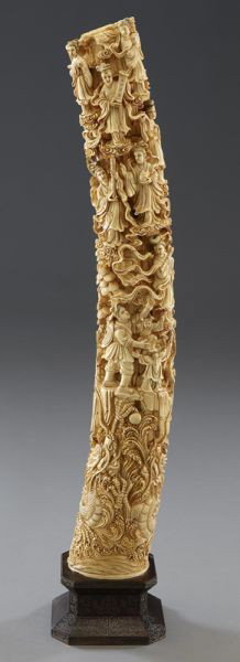 Chinese carved ivory tusk depicting immortals: (International buyers should note that several countries do not allow the importation of lots containing materials made from endangered species. This includes, but is not limited to, ivory, coral and 