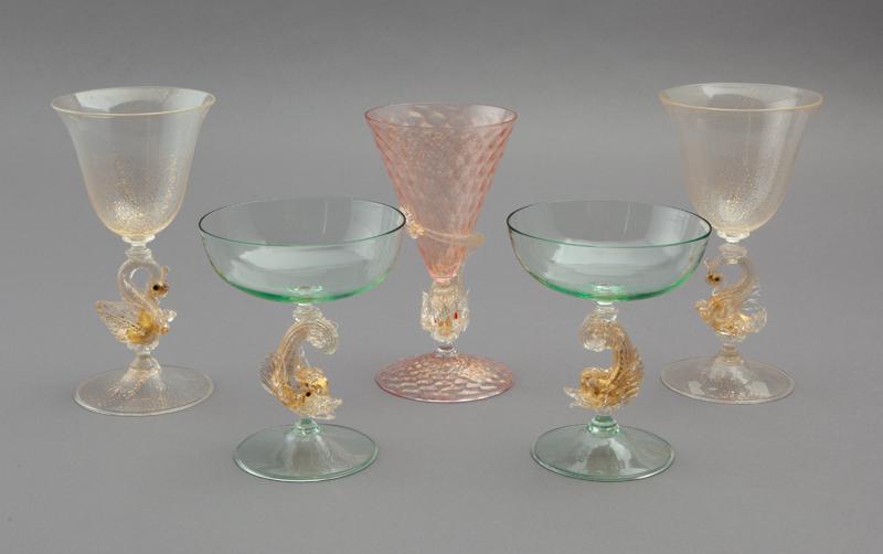 (5) Venetian wine glasses: (5) Venetian wine glasses, including: (1) with pink bowl and foot in diamond quilted pattern with dolphin stem (7"H); (2) green glass champagne coupes with dolphin stem (5.5"H); (2) pale yellow goblet