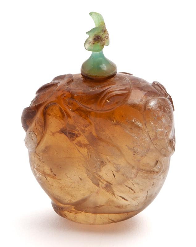 Chinese Qing carved golden hair crystal snuff: Chinese Qing carved golden hair crystal snuff, bottle, depicting a bat and peach leaves. 1.75"H without lid, Circa - 18th-19th C.