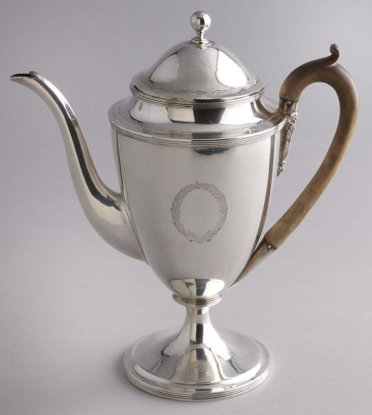 George III sterling silver teapot,: the lid with engraved foliate border, the teapot crested having a wooden handle. Marked for Henry Chawner and John Emes, London, 1796-97. 26.465 ozt. 10"H,