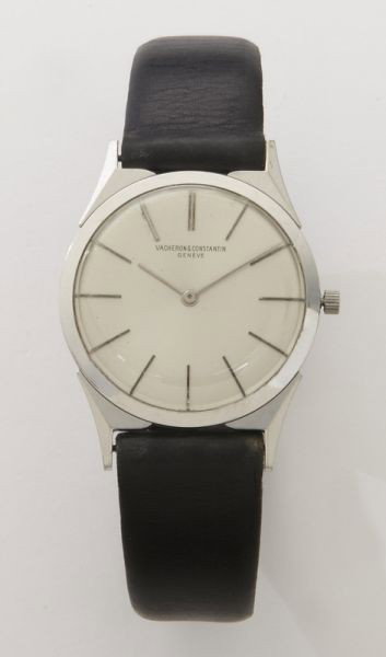 Vacheron Constantin 18K gold wrist watch,: the dial marked, Vacheron Constantin, Geneve, the 17 jewel movement stamped, "2955", the 18K case stamped, "379297 6099", on a black leather strap. Watch with Vacheron et Constantin red leather case. 