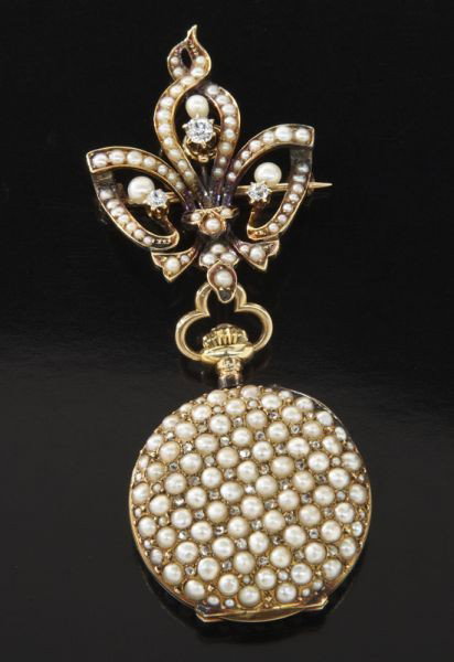 Edwardian 14K gold, diamond and pearl brooch watch: having a seven jewel Swiss movement, the dial surrounded by natural Oriental seed pearls, the case mounted with sea pearls and rose cut diamonds, the detachable pendant with Old European cut diamonds 