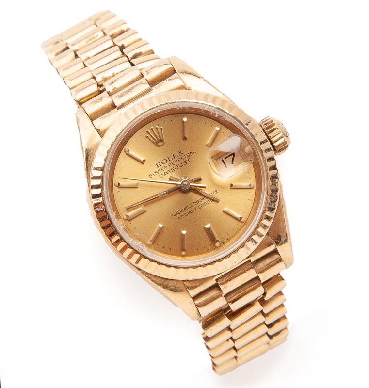 18K Gold Rolex Oyster Perpetual ladies watch: 18K Gold Rolex Oyster Perpetual ladies watch having inset date register, gold dial, gold bezel and crown. Case diameter: 28mm (including crown); Total weight 69.8 grams. Stamped, "Rolex 750 18K". Seri