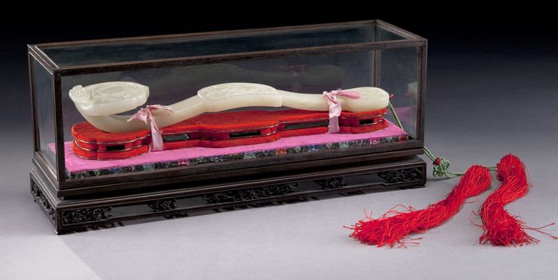 Chinese carved jade ruyi scepter: depicting peaches, guava and Buddha's hands, set in the original box. Scepter: 12.5"L, Box: 5.75"H x 14"W x 4.25"D, Circa - Early 20th C.
