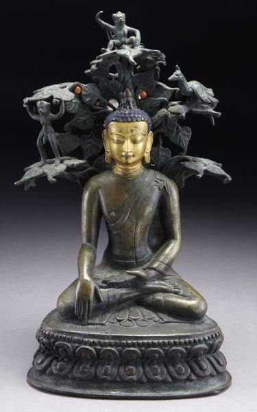Chinese - Tibetan Qing bronze Shakyamuni Buddha: seated on a lotus throne, his right had in bhumisparsha mudra, his left hand in dhyana mudra, with a coral inlaid bodhai tree on his back, monkeys and birds in the tree. 10.5"H, Circa - 17th - 18th C.