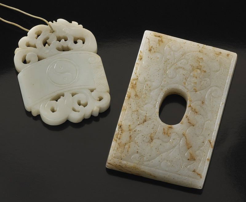 (2) Chinese Qing carved jade plaques,: (1) depicting Tai-Chi and double happiness; (1) depicting dragons. Largest: 2.75"H x 1.75"W, Circa - 17th - 19th C.