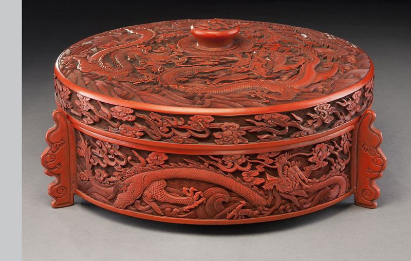 Chinese carved cinnabar round box: depicting dragons in clouds. 6"H x 12.25" Dia., Circa - 20th C.