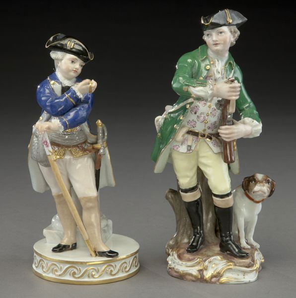(2) Meissen porcelain figures,: (1) modeled as a gentleman in fancy dress with a sword and a walking stick; (1) modeled as a hunter with his dog. Both with cross swords mark in blue under glaze, as well as impressed, incised and ove