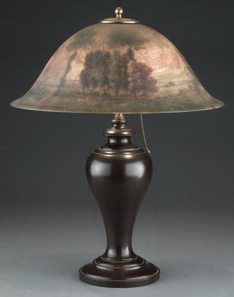 Pairpoint Reverse Painted scenic table lamp: having a Copley shade with 'chipped ice' finish, the interior painted with a lakeside scene, artist signed: 'C. Chace' and stamped in gold: 'The Pairpoint Corp'. The wooden baluster base marked: 'Pair
