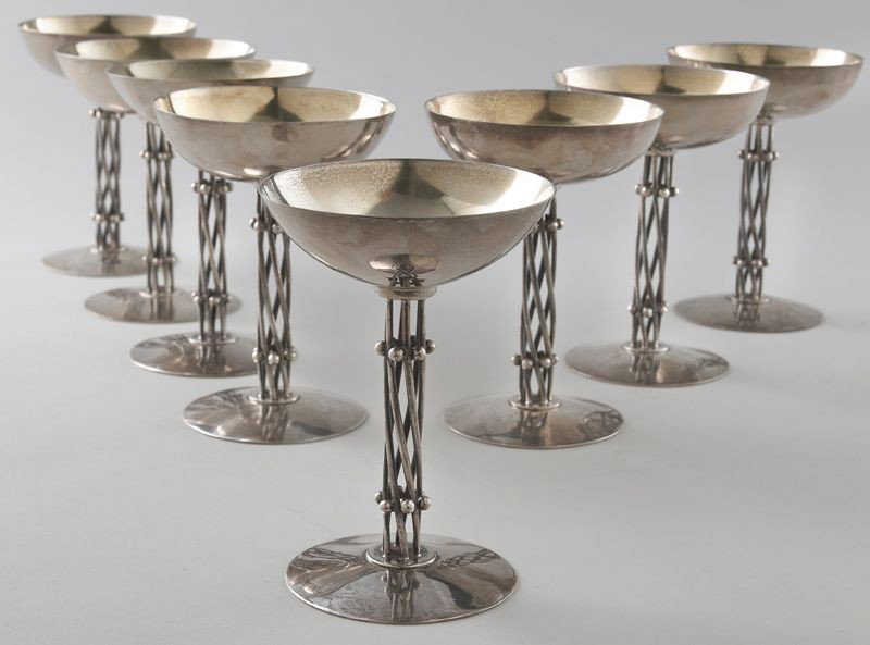 (8) William Spratling sterling silver champagne: goblets having twisted and beaded wire stems and gilt interiors. Stamped, "William Spratling Taxco 925", with eagle 63 mark. 61.72 ozt. 6"H, Circa - Mid 20th C.