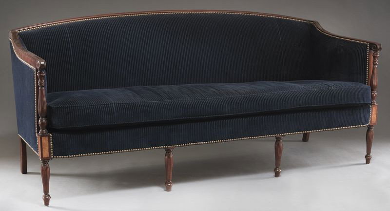 American Federal style mahogany framed sofa: with dark blue upholstery, the arms supported by turned and reeded columns and the whole supported by four similar front legs and square splayed back legs. 34" H x 77.25" W x 30" D, Circa - 1900.