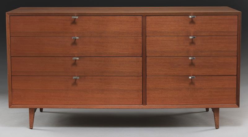 George Nelson for Herman Miller Thin Edge chest: having eight drawers, raised by tapered legs. With a rectangular metal tag. 29.75"H x 57.5"W x 18.75"D, Circa - Mid 20th C.