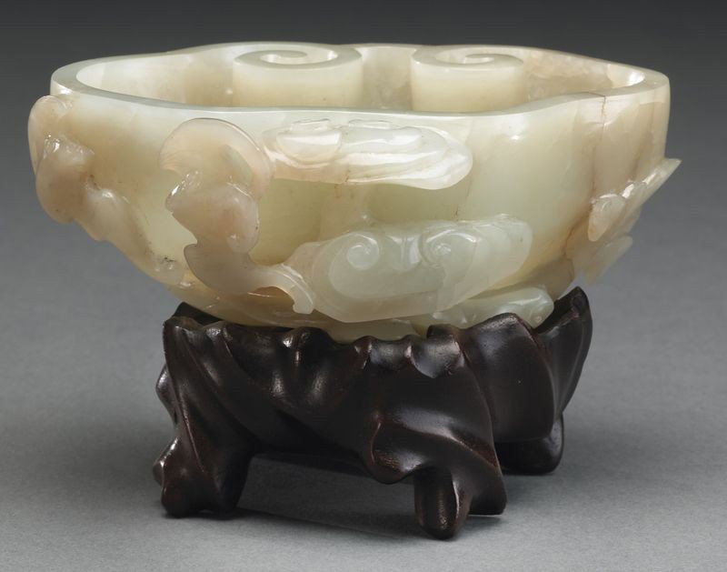 Chinese Qing Qianlong carved jade brush washer: having a ruyi shape, depicting bats and Lingzhi. 1.5"H x 3"W x 3.5"D, Circa - 18th C.
