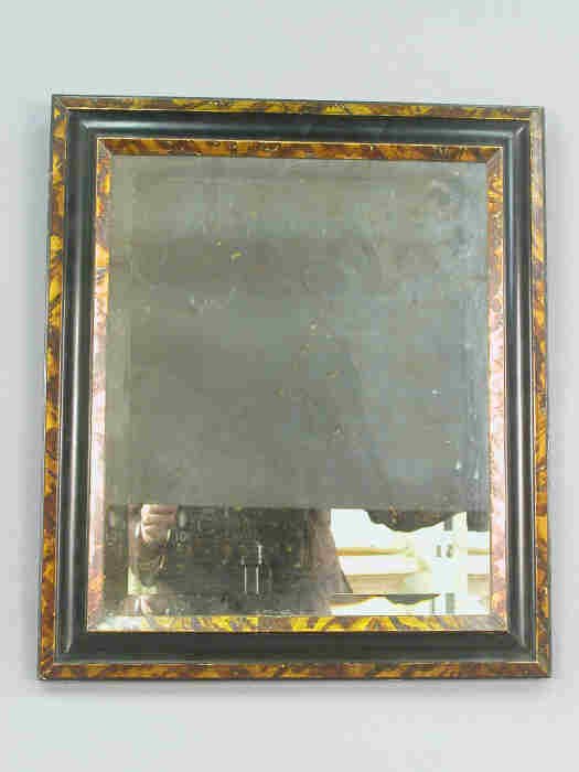 Faux tortoise framed shell beveled mirro: Faux tortoise framed shell beveled mirror. 22 1/4"H x 19 1/4"W, Circa - Early 20th C. 45498 28221 A6931724