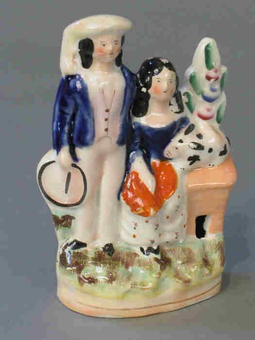 Staffordshire boy and girl with rabbit.