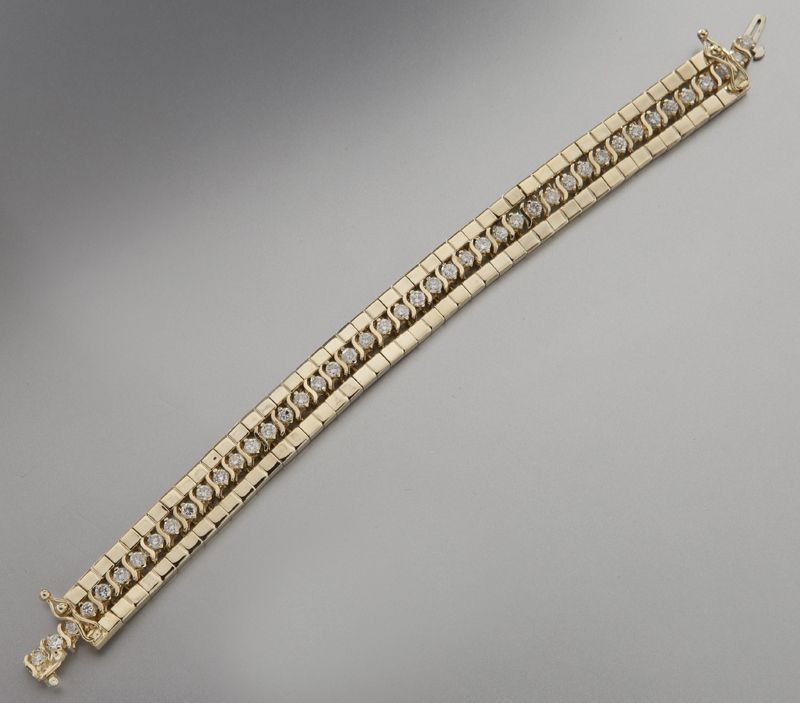 82 14K gold and diamond tennis bracelet with jacket Feb 29, 2012