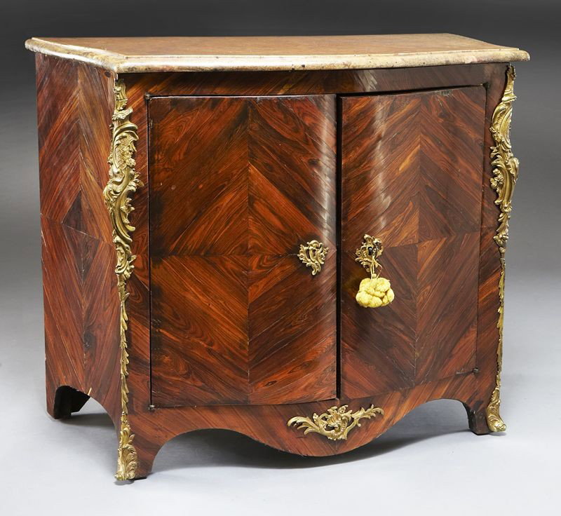 Transitional Louis XV/XVI marble top commode: Transitional Louis XV/XVI marble top commode with diamond parquetry inlay, the shaped marble top above two doors, the interior fitted with one shelf, having acanthine ormolu mounts and escutcheons. 32