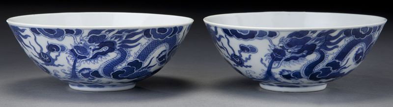 Pr. Vietnamese blue and white porcelain bowls: Pr. Vietnamese blue and white porcelain bowls depicting dragons chasing the flaming pearl, four character mark on base. 2"H x 5.5" Dia., Circa - 19th C.