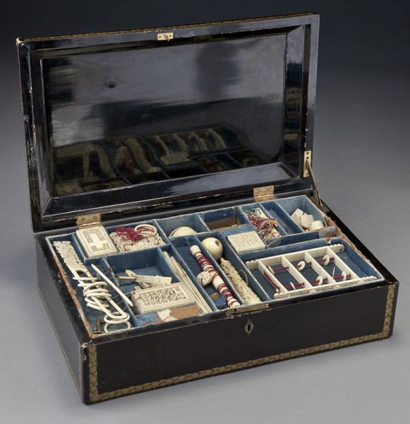 22 Pc. ivory game/puzzle set, including:: 22 Pc. ivory game/puzzle set, including: (International shipping IS NOT available on this lot) Chinese rings, puzzle ball, cup and ball, rods and strings, and other assorted puzzle games. Largest piec
