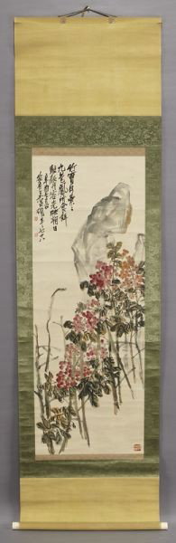 Chinese watercolor scroll attr. to Wu Changshuo: Chinese watercolor scroll attr. to Wu Changshuo depicting rocks and plants, set in an old wood box. Wu Changshuo (Chinese, 1844-1927). Site: 47"H x 16.75"W.