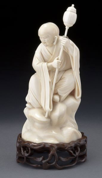 Chinese carved ivory Lohan,: Chinese carved ivory Lohan, (International shipping IS NOT available on this lot) holding Buddhist attributes, seated on a rock. Ivory: 8"H, Circa - Early 20th C.