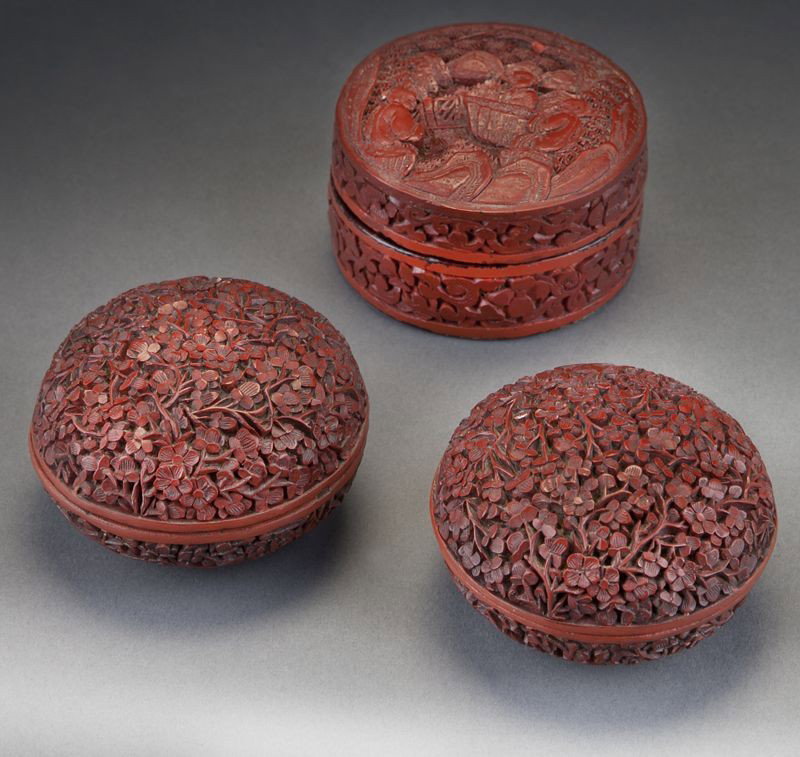 (3) Chinese Qing carved cinnabar ink pads,: (3) Chinese Qing carved cinnabar ink pads, depicting plum blossoms and landscapes. Largest: 2.5" Dia., Circa - 18th - 19th C.