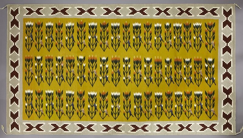 Native American Navajo rug having grey borders: Native American Navajo rug having grey borders with maroon and white geometric patterns, surrounding the gold colored middle filled with bird pictorials in various colors. 108"H x 65"W, Circa - Late 2