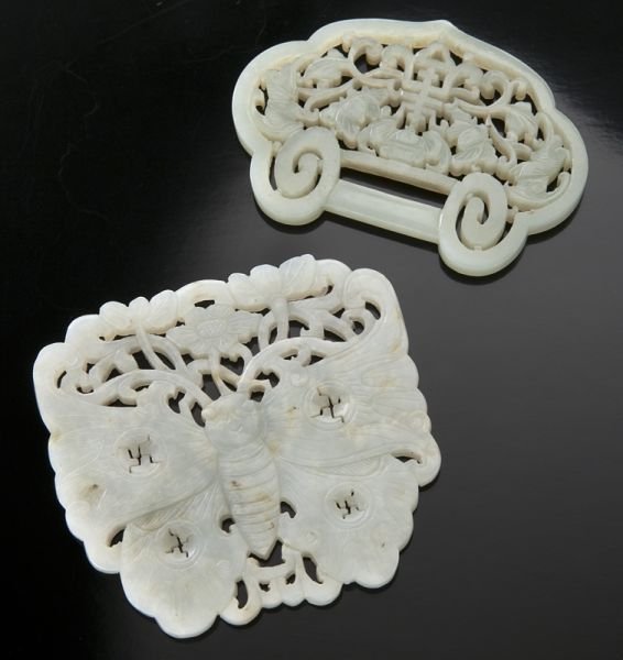 2 Pcs. Chinese Qing carved jade, including:: 2 Pcs. Chinese Qing carved jade, including: (1) pendant depicting bats and lotus, 2.25"H x 3.25"W; and (1) butterfly, 3.25"H x 2.25"W, Circa - 19th C.