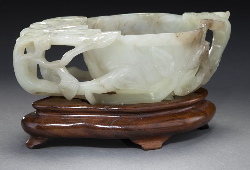 Chinese late Ming-early Qing carved jade brush: Chinese late Ming-early Qing carved jade brush washer, depicting flowers and a chilong dragon. 2.25"H x 7"W x 3.5"D, Circa - 17th C.