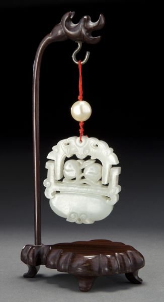 Chinese Qing carved white jade pendant: Chinese Qing carved white jade pendant depicting a swinging flower basket, hanging on a rosewood stand. Jade: 2.75"H x 2.5"W, Circa - 18th - 19th C.