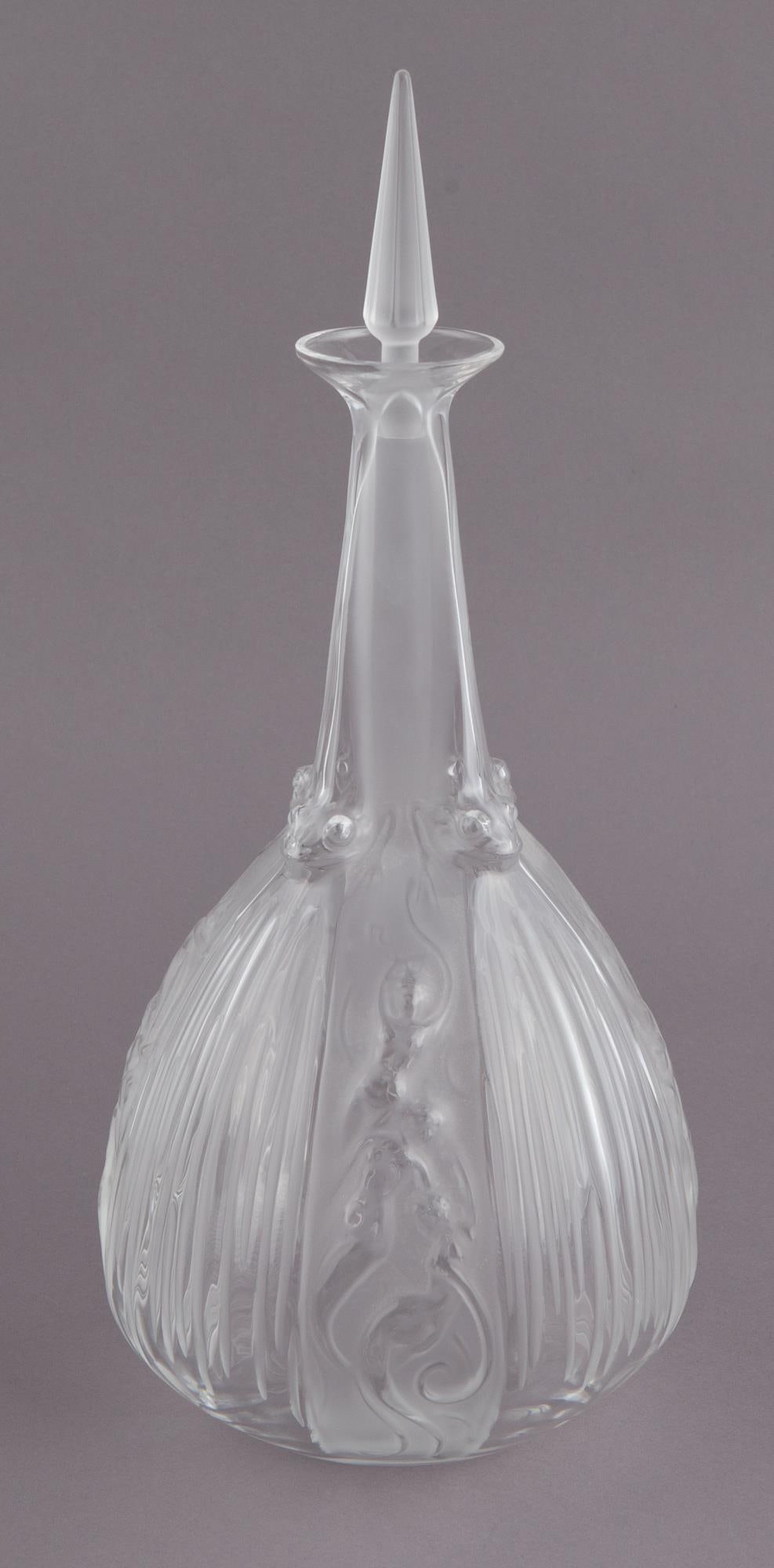 Lalique Sirenes et Grenouilles Decanter: Beautiful Lalique Sirenes and Grenouilles Decanter with intricate decorations depicting sirens and frog. H 11.5 x W 6 in