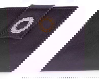 Celine Bifold Ladies Wallet: Black with tan interior. Coin holder with two slots for credit cards and bill compartment. H 3.25 W 4