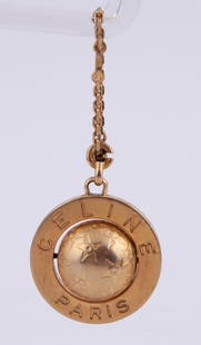 Celine Keychain.: Celine gold tone globe keychain.