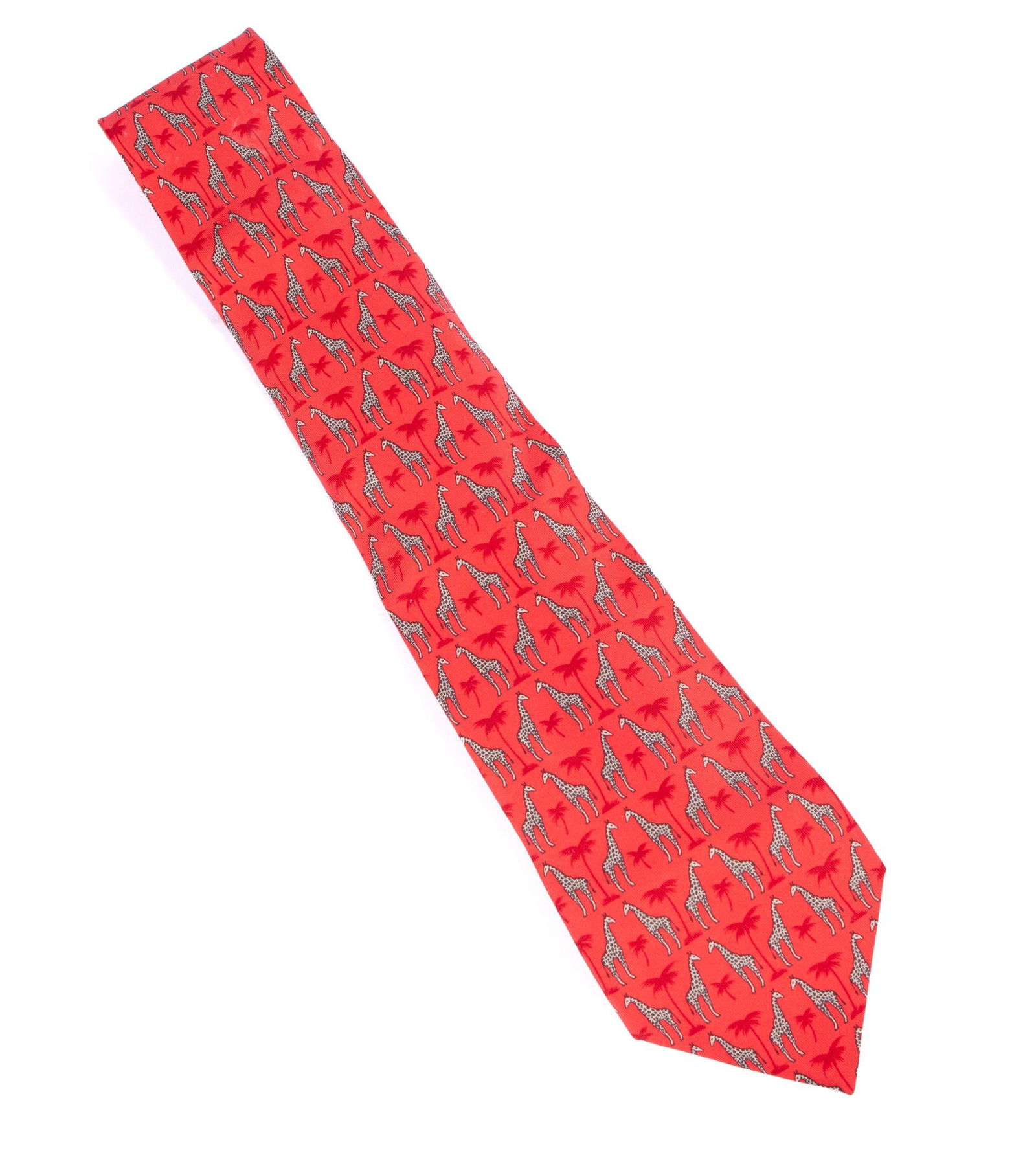 Hermes Tie: Red silk tie, Palm tree and giraffe design with box. Measuring 59.5 in