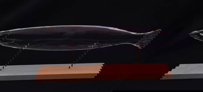 Baccarat Sculpture: Titled Barracuda, no. #559 Baccarat glass fish sculpture on wooden stand. With original box, signed by Francois Xavier Lalanne (FXL). H 3.5 W 10 in