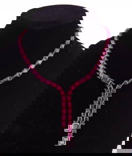 65ct. Ruby and Diamond Necklace: Approximately 65.72 carat natural ruby and diamond necklace. Diamonds are G-H in color and Vs/SI with a TCW of 1.09. set in 14kt gold.