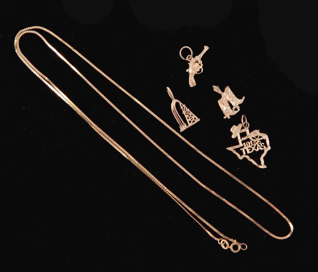 14ct Gold Necklace with Texas Charms: With four charms including Texas State, cowboy boots, gun, oil rig.Weight 6g