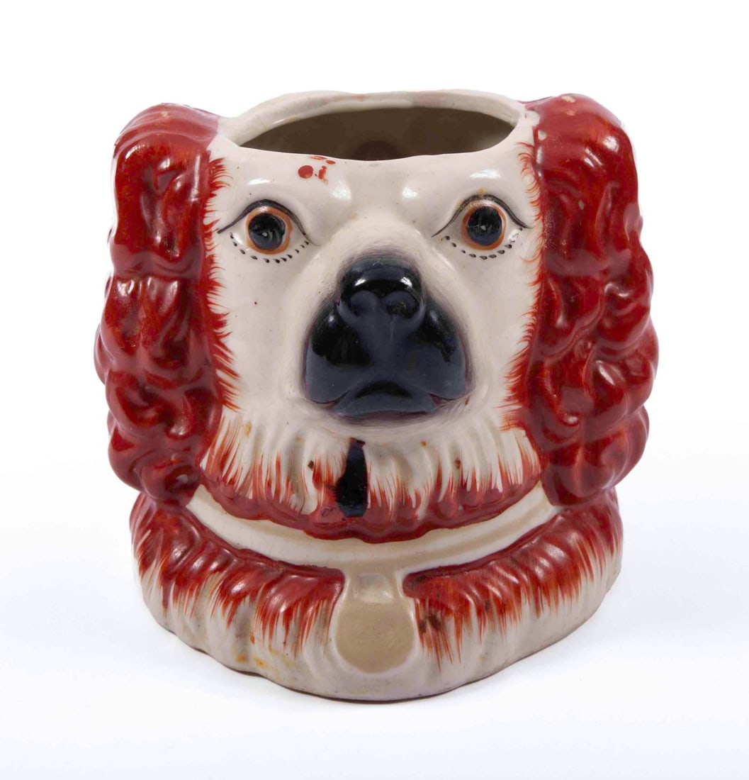 Staffordshire Ceramic Two Headed Spaniel Mug: Spaniel with red hair, face on both sides. Measuring H 5.4 W 4.4 in Provenance: Private Dallas collector No reserve