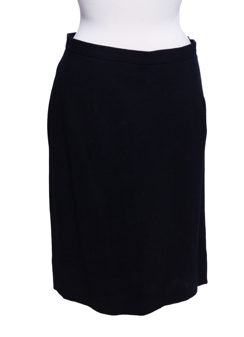 Christian Dior Women's Wool Mid Length Skirt: Elegant single button wool black skirt. 22 in length, size 16 In good condition