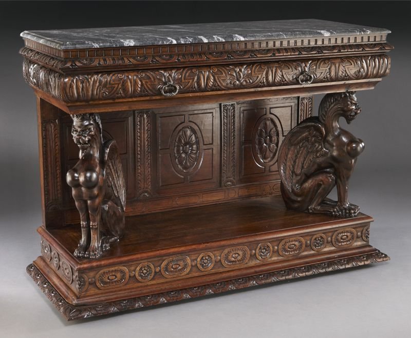 Highly carved marble top walnut credenza: Highly carved marble top walnut credenza with grey and white marble over one full width carved drawer supported by two fully carved winged griffins and a three panel carved backboard, on a base with c
