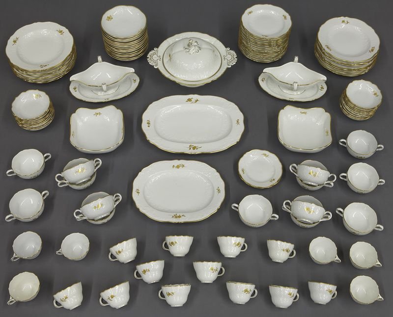 104 Pcs. Meissen porcelain partial dinner service: 104 Pcs. Meissen porcelain partial dinner service having raised floral and beaded detail with gilt painted flowers, including: (16) plates; (16) dessert plates; (14) bowls; (17) dessert bowls; (18) te