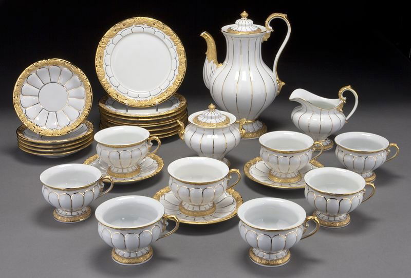 27 Pc. Meissen porcelain tea and dessert service,: 27 Pc. Meissen porcelain tea and dessert service, including: (1) teapot; (1) covered sugar; (1) cream; (8) teacups with (8) saucers; and (8) dessert plates. Crossed swords mark in blue under glaze wit