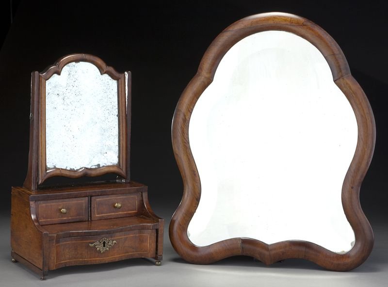 (2) Antique mirrors including an early French: (2) Antique mirrors including an early French easel mirror with wide cartouche shaped wooden frame enclosing a conforming beveled glass mirror, 18.5"H x 15"W; and a miniature dressing table mirror wit