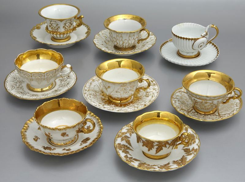 (8) Sets of Meissen porcelain teacups and saucers: (8) Sets of Meissen porcelain teacups and saucers having white grounds accented by gilt rims and gilt painted design. All with cross swords mark in blue under glaze, as well as impressed, incised and
