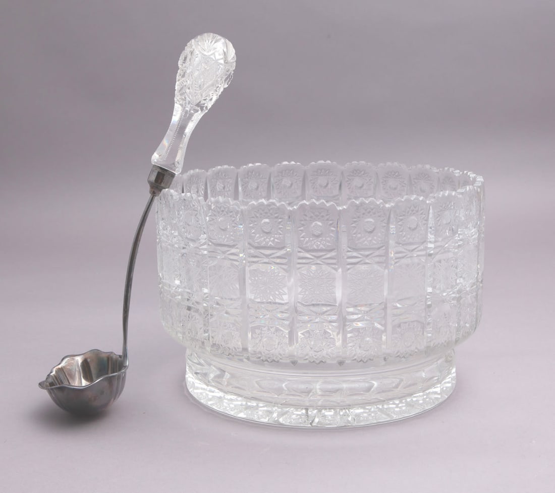 Large American Brilliant Cut Punch Bowl: Large Punch bowl with ladle with geometrical decor. Ladle marked Reed & Barton on side. Measuring H 7.5 W 11.3 in In good condition. Provenance: Floyd and Beverly Sherman's Private Collectio