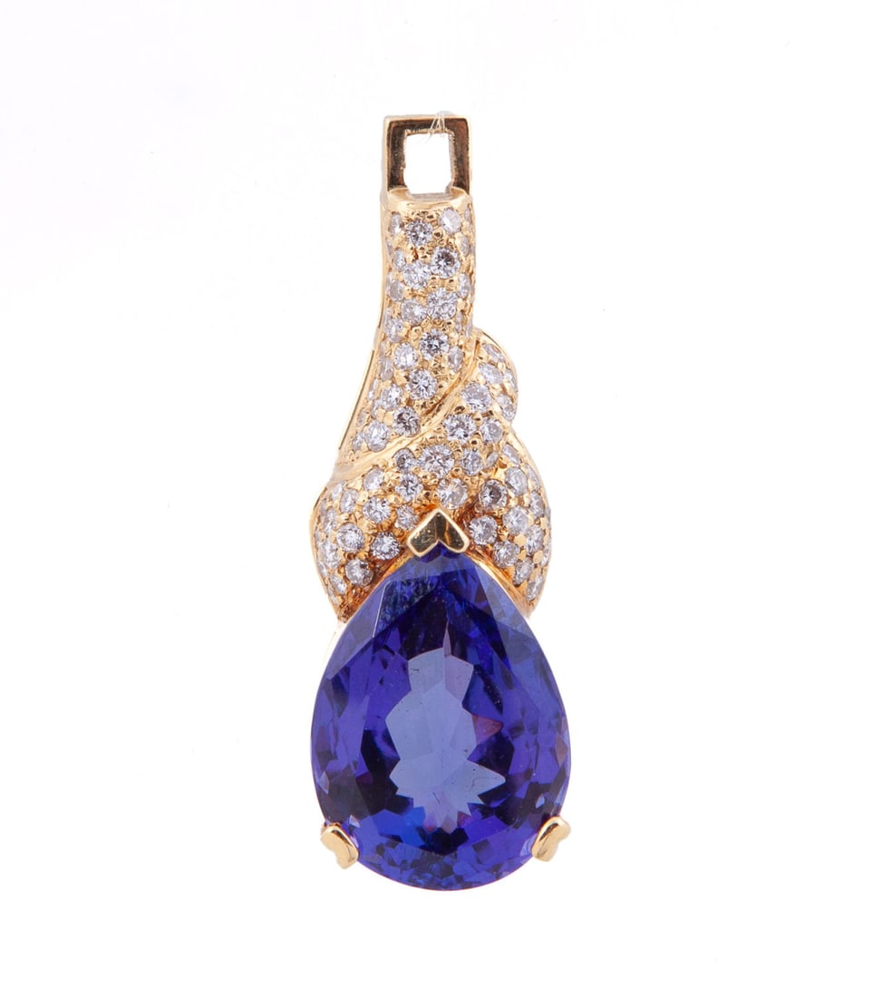 Ladies 18kt Gold Tanzanite and Diamond Pendant: Teardrop-shaped tanzanite (17 carats) set in 18k yellow gold with 75 round diamonds (.75 carats each) Total weight: 13.8g In pristine condition