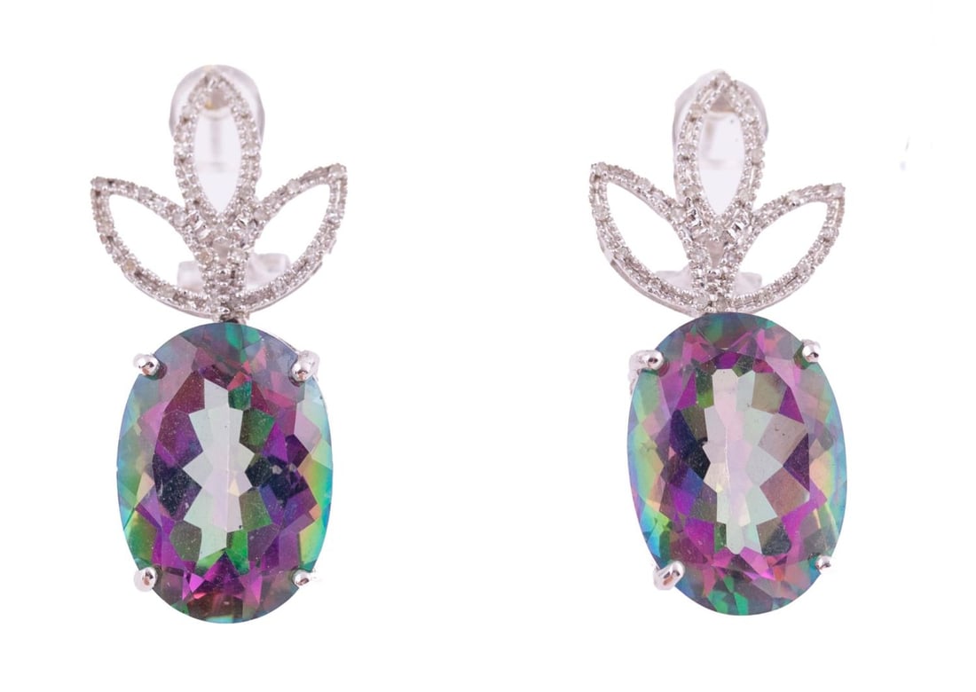 Alexandrite and Diamond Earrings: Large oval alexandrite set in 14kt white gold decorated with three leaves on top surrounded by round diamonds. Total weight 10.1g For pierced lobes, with clasp closure. In pristine condition.