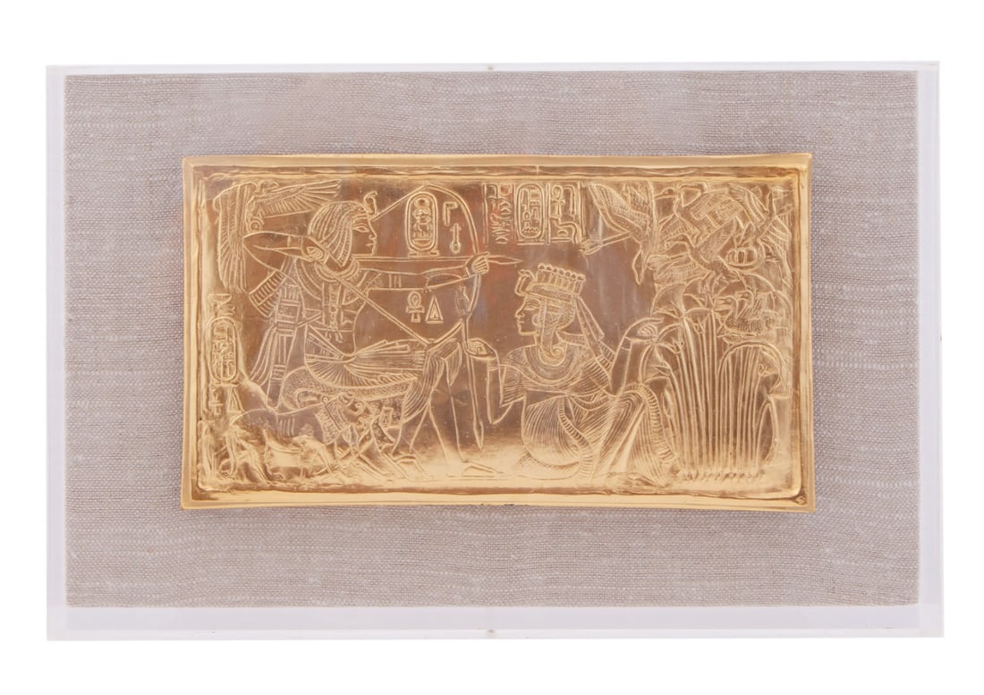 1976 Metropolitan Museum of Art MMA Egyptian King Tut Gold Plaque Shadow Box: Carved gold plaque portraying King Tutankhamun. On a lined shadowbox. Measuring H 9 x W 14 x D 2 in In good condition, exhibited.