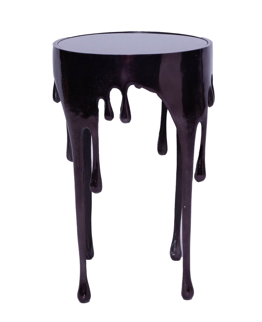 Contemporary Black Aluminum Drip Accent Table with Melting Designed Legs: Quirky contemporary style black aluminum table with drip and melting design on the frame and shaded glass top. Measuring H 25 D 15.5 in In fair condition, some scratches to the surface